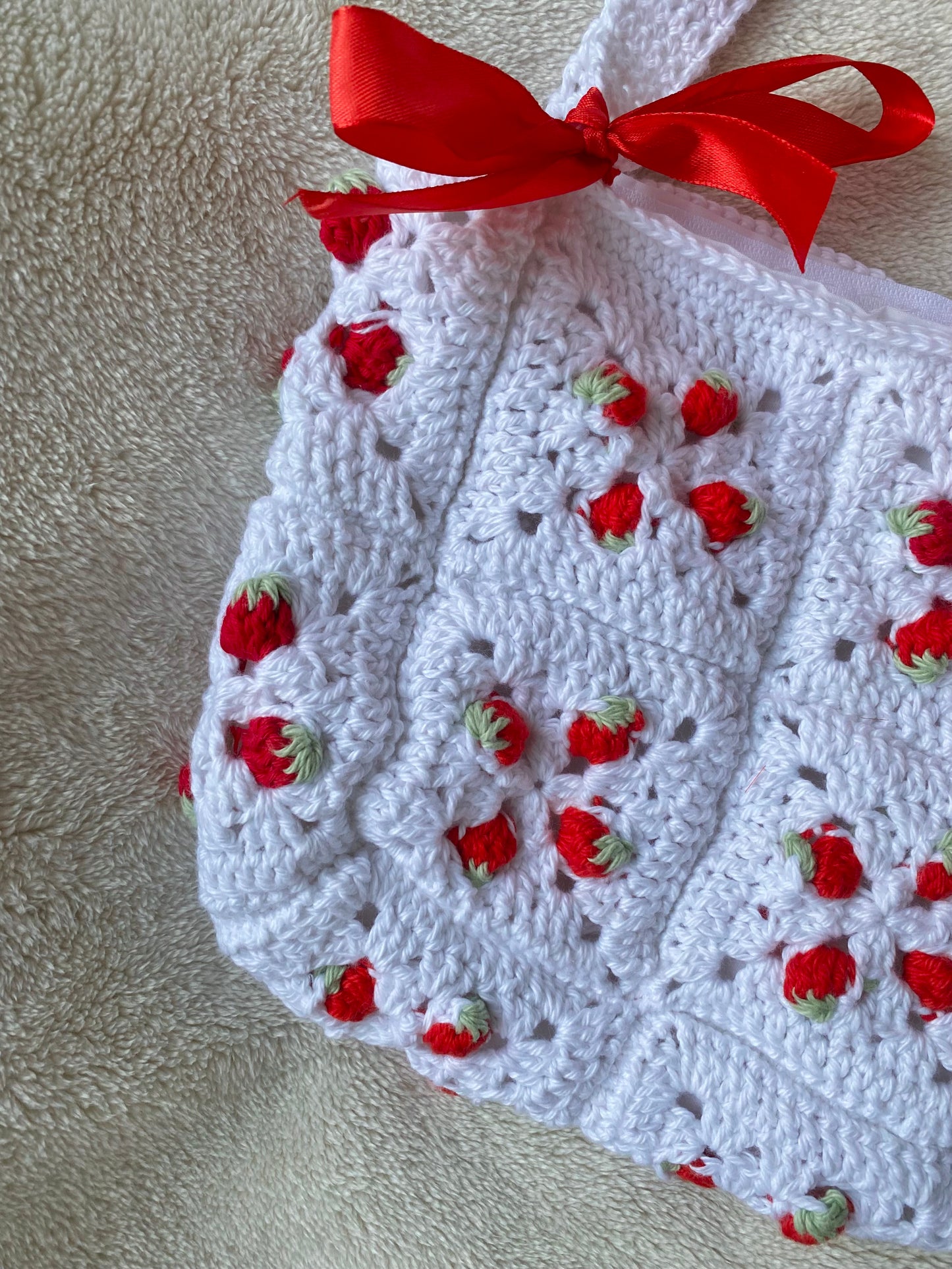 Cute crochet bag with strawberries and ribbons