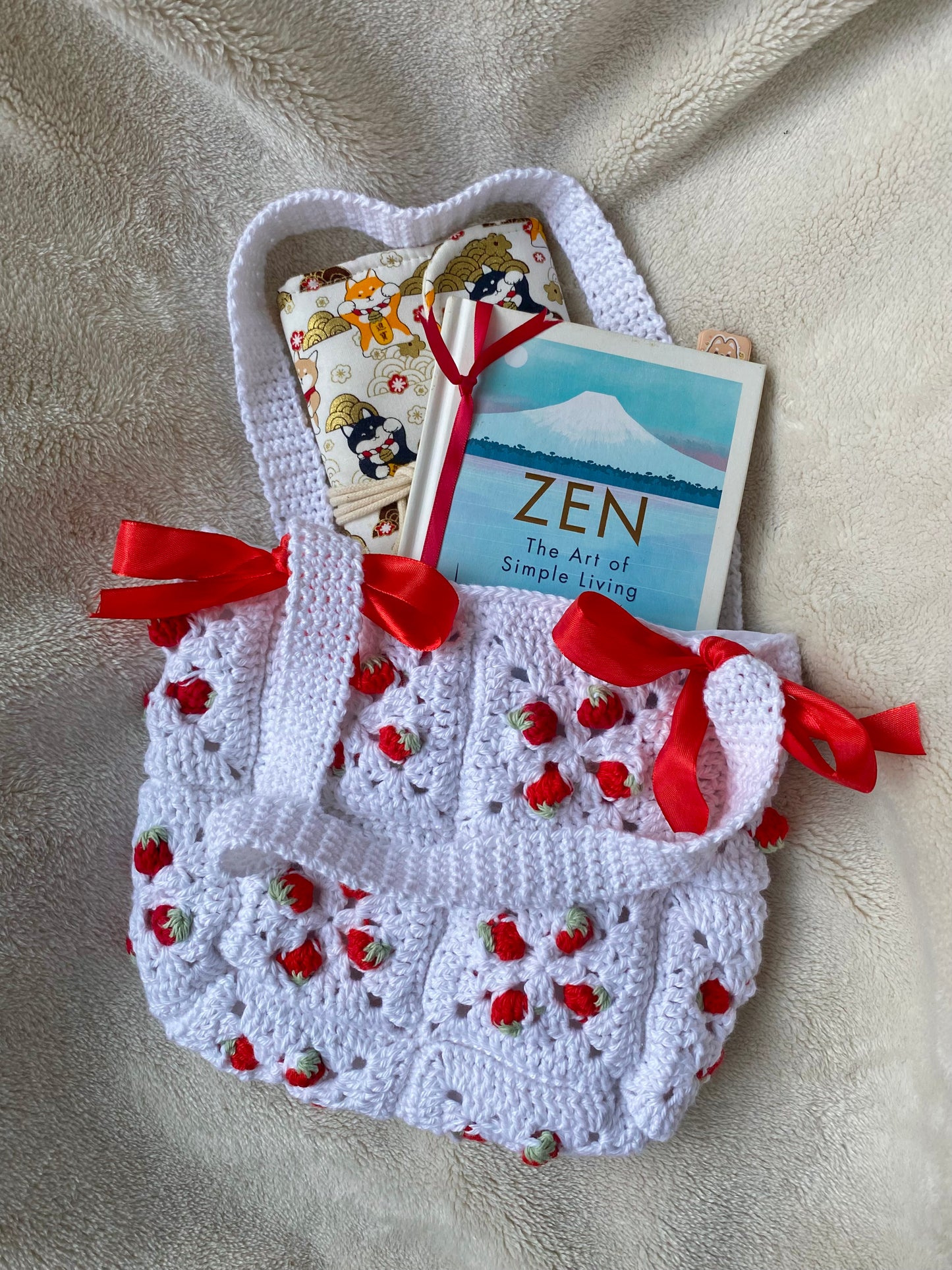 Cute crochet bag with strawberries and ribbons