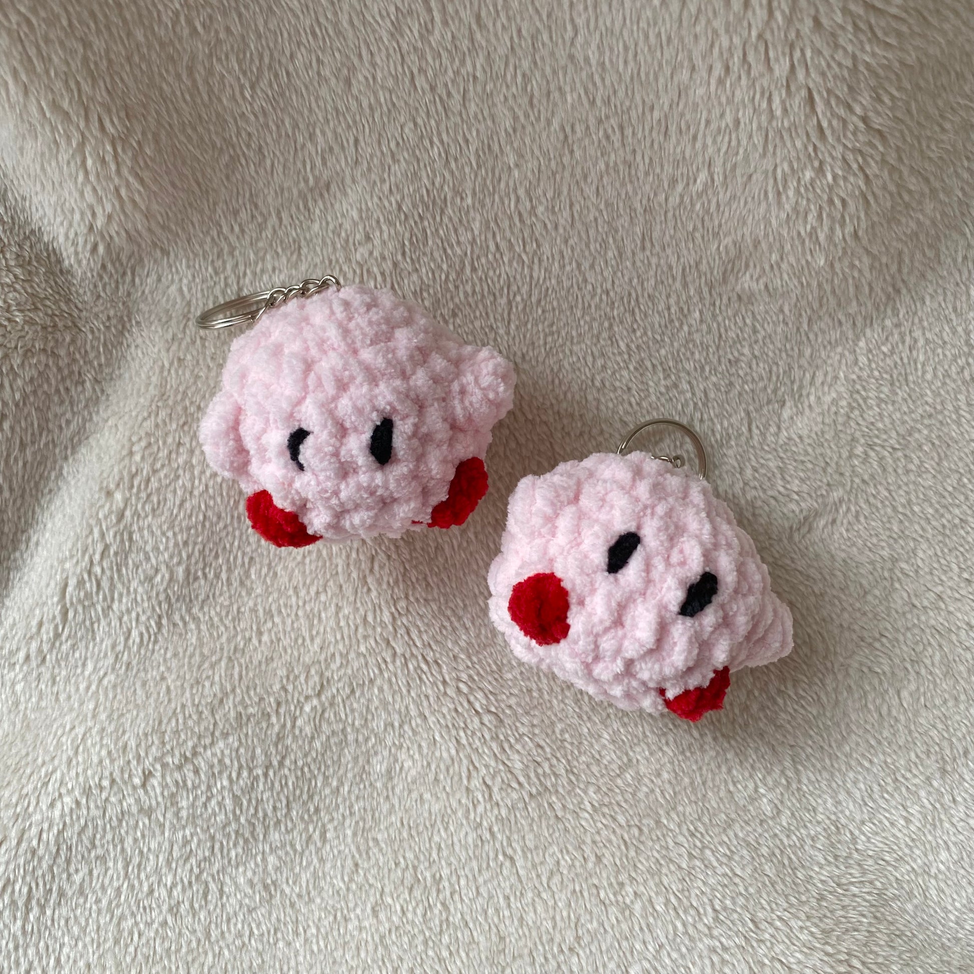 Cute crochet Kirby keyring made with plush and fluffy yarn