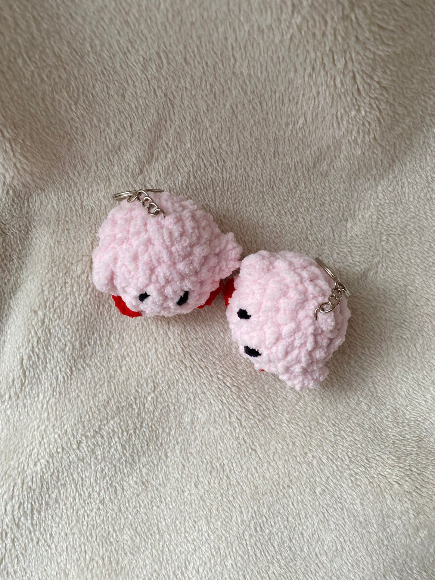 Cute crochet kirby keyring made with plush and fluffy yarn